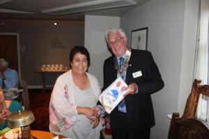 Ian presenting Razia with our club pendant